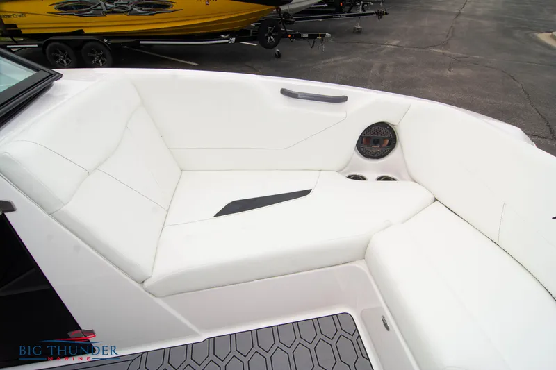 Slide: The Image of 2023 MasterCraft NXT22 boat interior with white seating and speaker. - 43