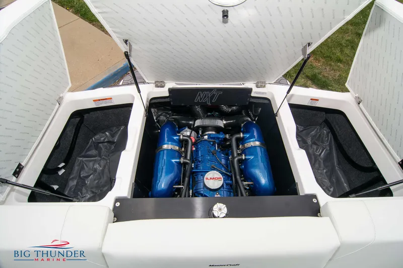 Slide: The Image of 2023 MasterCraft NXT22 boat engine compartment with Ilmor engine at Big Thunder Marine. - 47