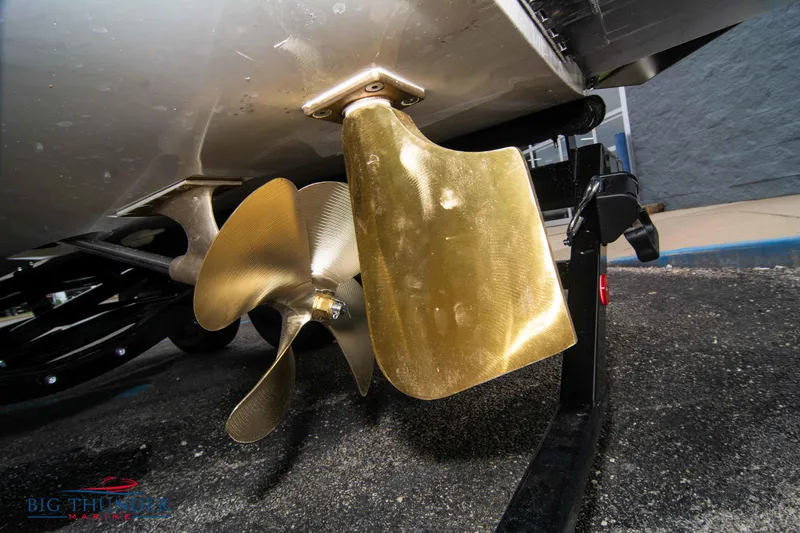 Slide: The Image of Close-up of 2023 MasterCraft NXT22 boat propeller and rudder on a trailer. - 8