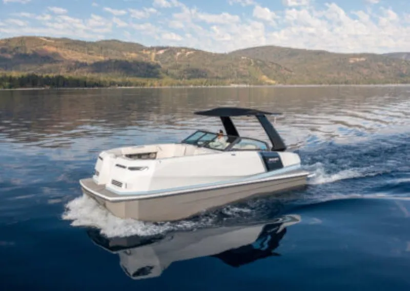 Slide: The Image of 2025 Ingenity EL boat cruising on a serene lake with scenic mountain backdrop. - 3