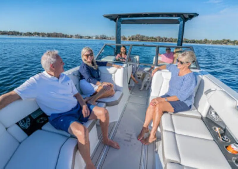 Slide: The Image of Group enjoying a sunny day on a 2025 Ingenity EL boat. - 9