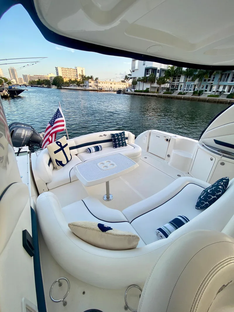 Slide: The Image of 2005 Sea Ray 420 Sundancer yacht with elegant seating area and waterfront view. - 11