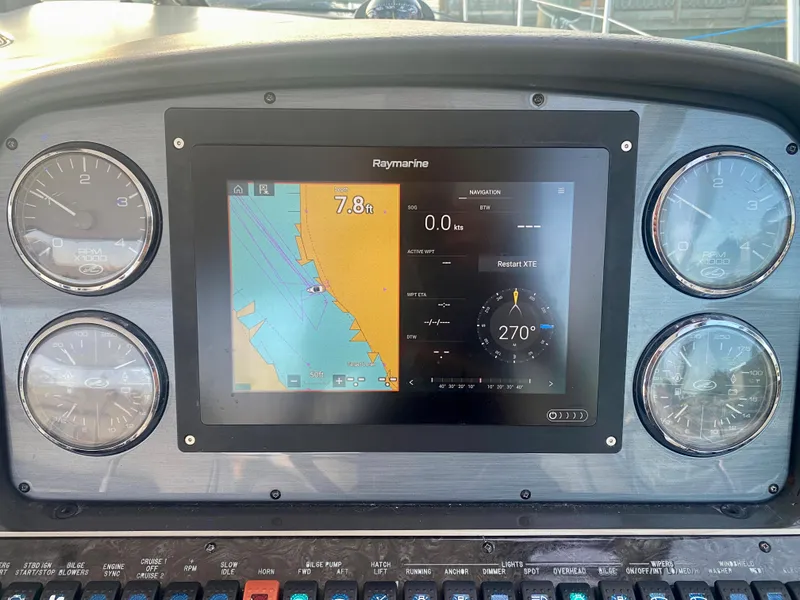 Slide: The Image of Dashboard of a 2005 Sea Ray 420 Sundancer with Raymarine navigation system. - 15