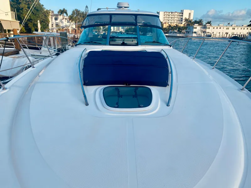 Slide: The Image of 2005 Sea Ray 420 Sundancer yacht docked in a marina. - 21