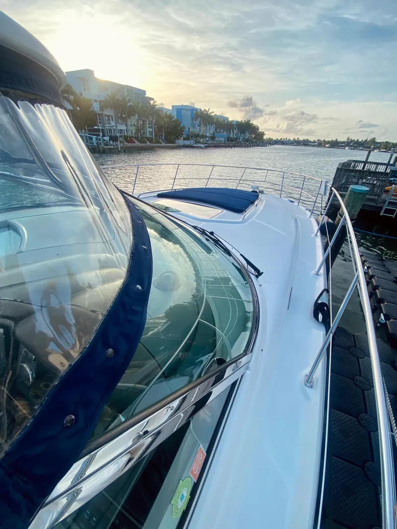 Slide: The Image of 2005 Sea Ray 420 Sundancer yacht docked at sunset. - 27