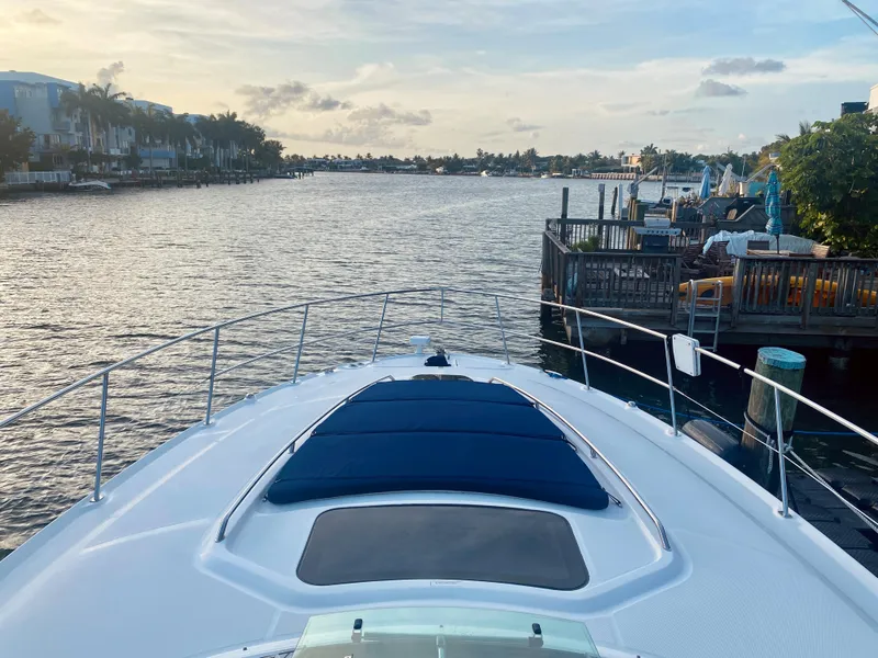 Slide: The Image of 2005 Sea Ray 420 Sundancer yacht cruising on a scenic waterway at sunset. - 30
