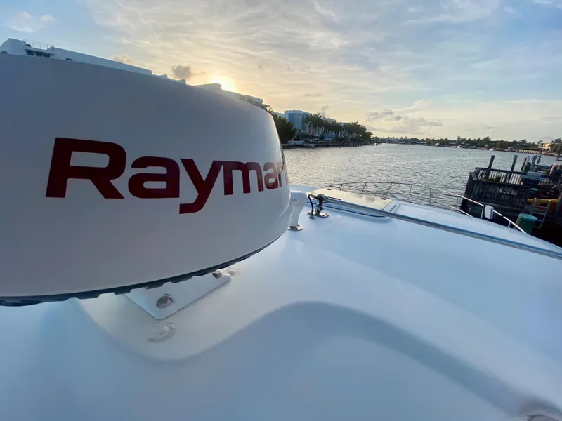 Slide: The Image of Raymarine radar on a 2005 Sea Ray 420 Sundancer at sunset by the water. - 31