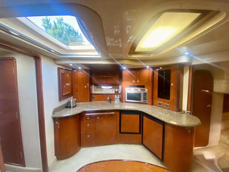 Slide: The Image of Luxurious 2005 Sea Ray 420 Sundancer yacht interior with modern kitchen and skylights. - 37