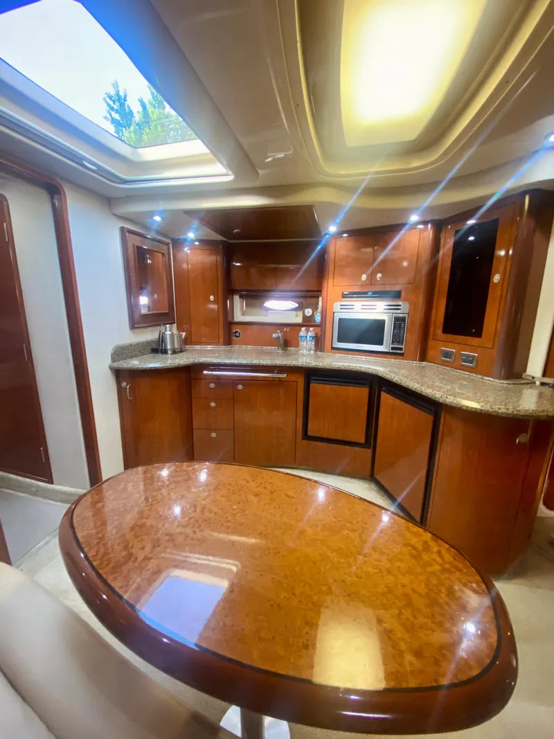 Slide: The Image of Luxurious kitchen interior of a 2005 Sea Ray 420 Sundancer yacht. - 38