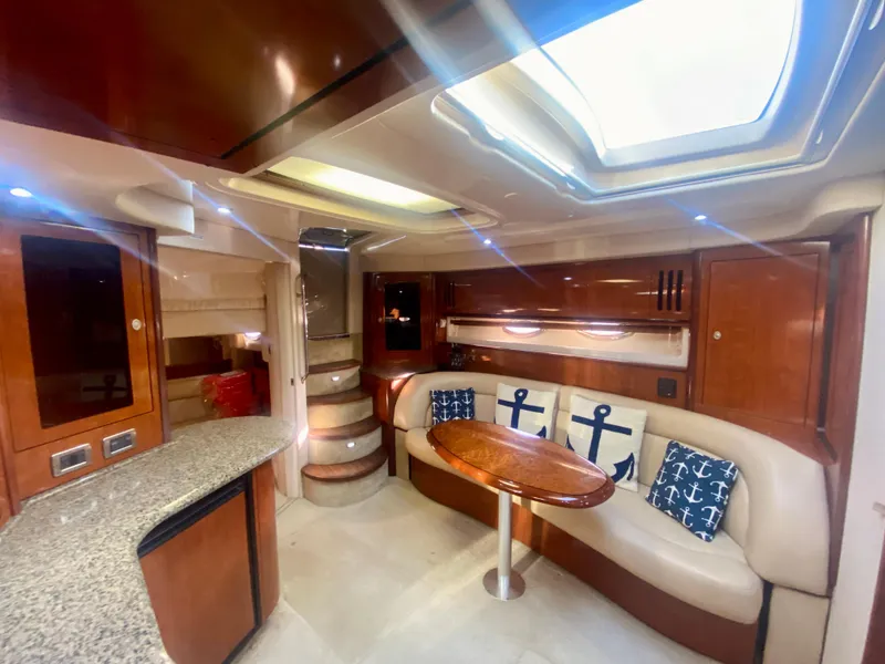 Slide: The Image of Luxurious interior of 2005 Sea Ray 420 Sundancer yacht with skylight and anchor-themed decor. - 42