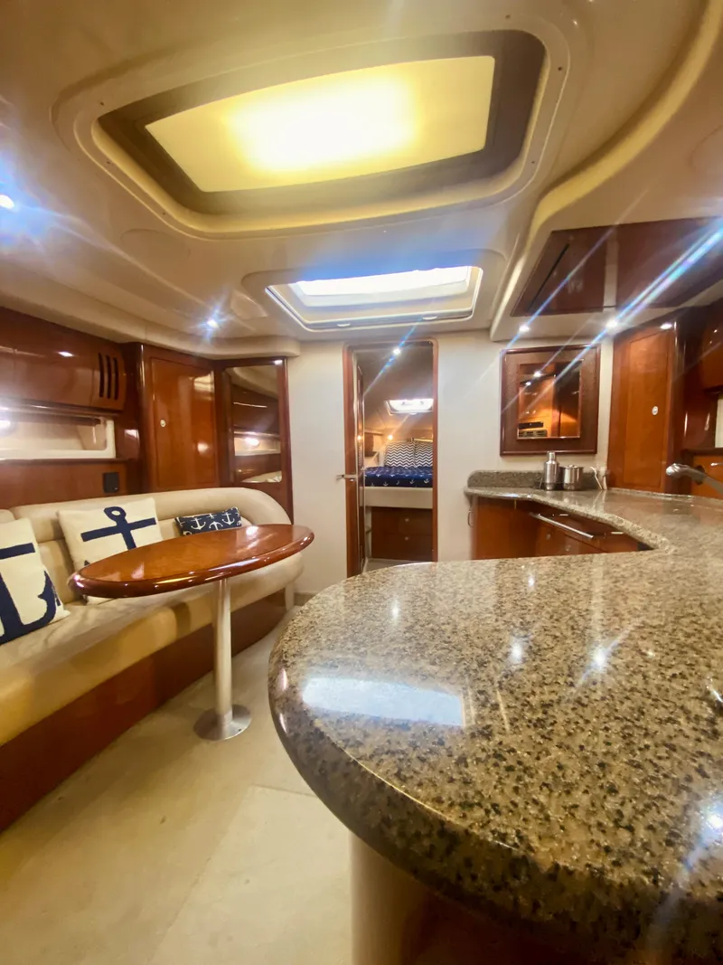 Slide: The Image of Luxurious interior of a 2005 Sea Ray 420 Sundancer yacht with granite countertops. - 43