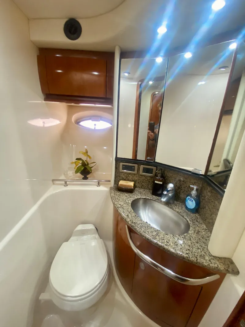 Slide: The Image of Luxurious bathroom in 2005 Sea Ray 420 Sundancer yacht with granite countertop and modern fixtures. - 47