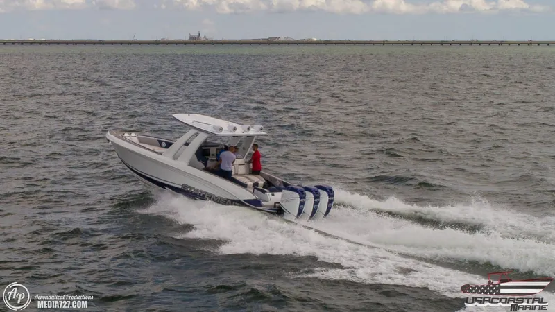 Slide: The Image of 2018 Statement 38 Open boat cruising on open water with four engines. - 15