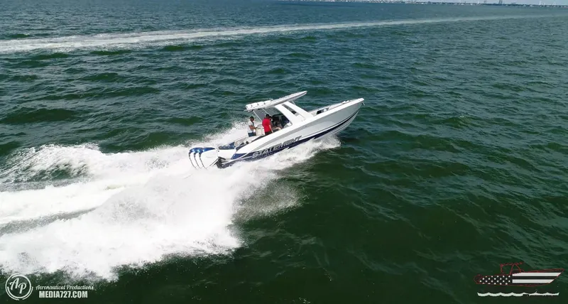 Slide: The Image of 2018 Statement 38 Open boat speeding on open water. - 18