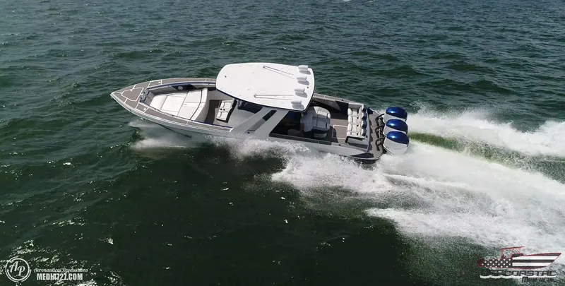 Slide: The Image of 2018 Statement 38 Open boat speeding on water with triple engines. - 21