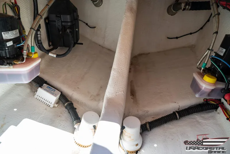 Slide: The Image of 2018 Statement 38 Open boat interior wiring and components. - 23