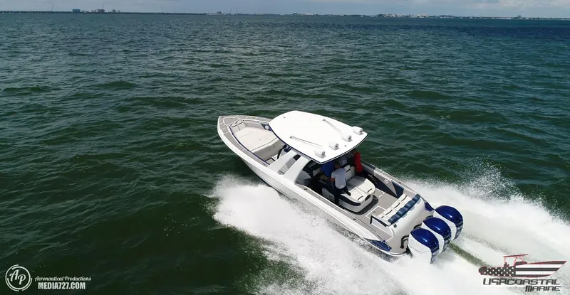 Slide: The Image of 2018 Statement 38 Open boat speeding on open water, aerial view. - 29