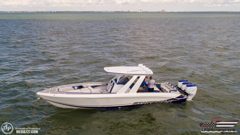 Slide: The Image of 2018 Statement 38 Open boat cruising on open water, side view. - 34