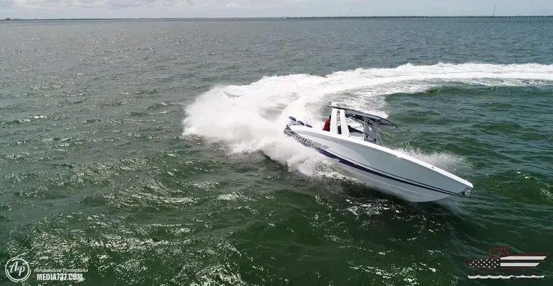 Slide: The Image of 2018 Statement 38 Open speedboat making a sharp turn on open water. - 35