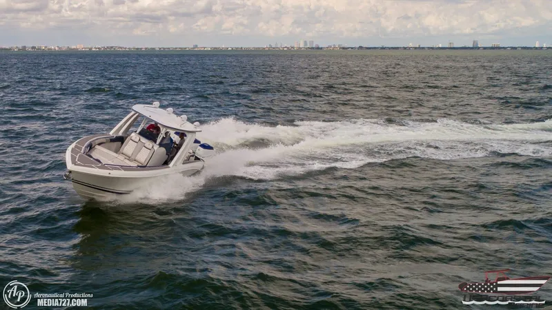 Slide: The Image of 2018 Statement 38 Open boat cruising on open water under cloudy skies. - 39