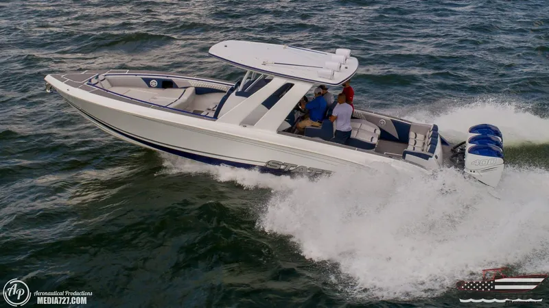 Slide: The Image of 2018 Statement 38 Open boat cruising on the ocean with three passengers. - 40