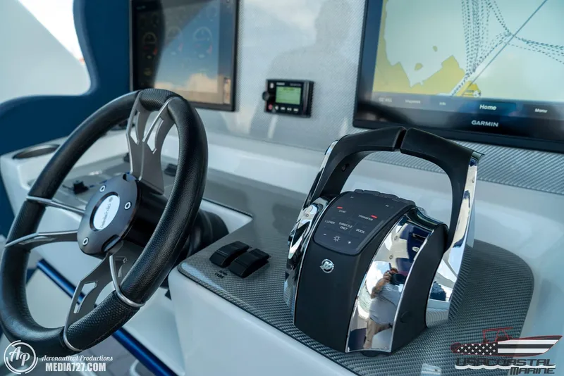 Slide: The Image of Control panel of 2018 Statement 38 Open boat with steering wheel and navigation screens. - 41