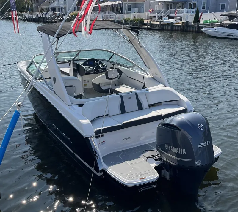 Slide: The Image of 2017 Regal 23 OBX boat with Yamaha 250 engine docked on a sunny day. - 3