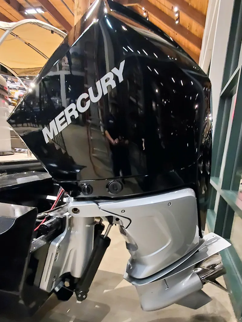 Slide: The Image of 2023 Regency 230 DL3 boat with a Mercury outboard motor. - 6