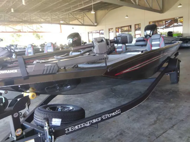 Slide: The Image of 2023 Ranger RT188P fishing boat on Ranger Trail trailer in showroom. - 1