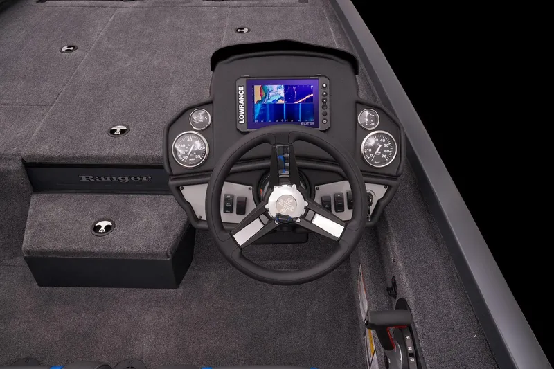 Slide: The Image of 2023 Ranger RT188P boat dashboard with steering wheel and Lowrance fishfinder. - 13