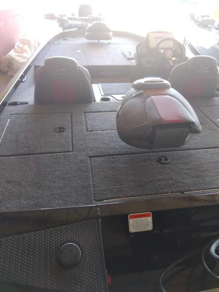 Slide: The Image of 2023 Ranger RT188P fishing boat interior with seating and control console. - 2