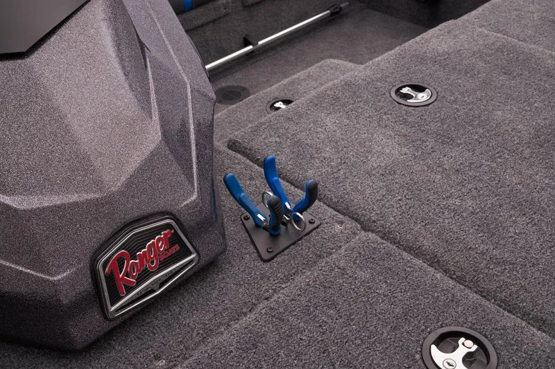 Slide: The Image of 2023 Ranger RT188P boat interior with storage compartments and tool holders. - 25