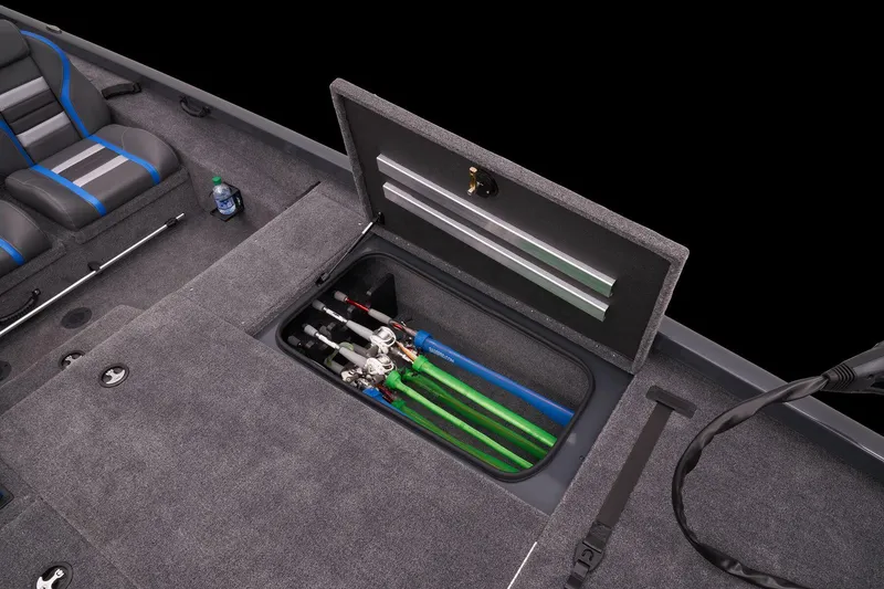 Slide: The Image of 2023 Ranger RT188P boat with open storage compartment and fishing rods. - 45