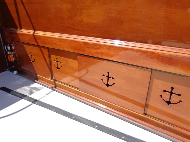 Slide: The Image of 1946 Monk Flybridge Sedan wooden storage cabinets with anchor handles. - 13