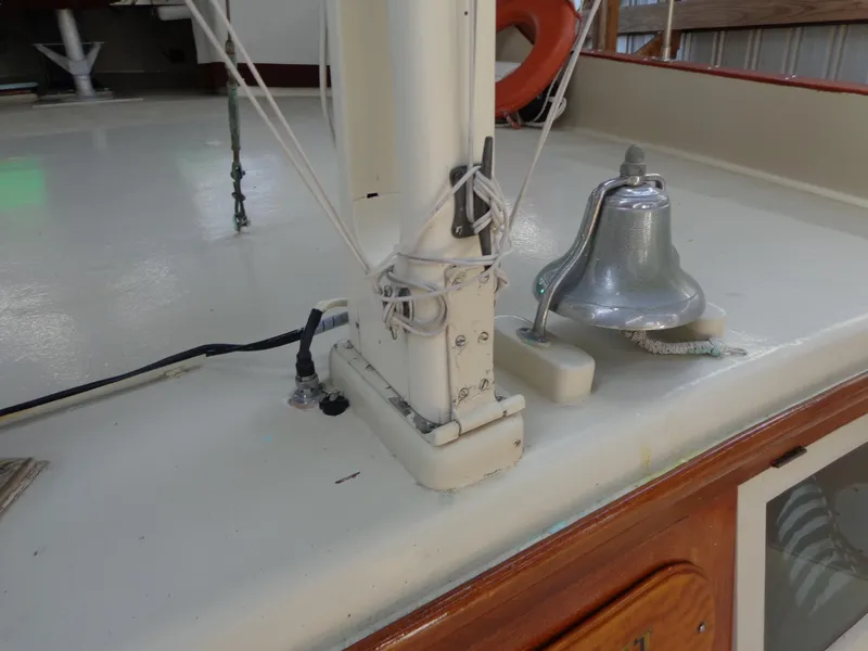 Slide: The Image of 1946 Monk Flybridge Sedan deck with bell and rigging. - 25