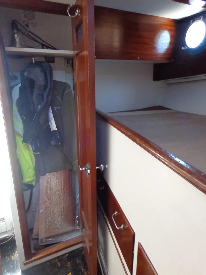 Slide: The Image of 1946 Monk Flybridge Sedan interior with closet and storage space. - 46