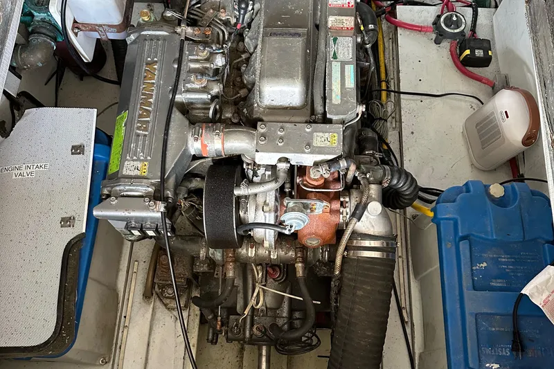 Slide: The Image of Engine compartment of a 2001 Mast & Mallet 38 Picnic Boat, featuring a Yanmar engine. - 28