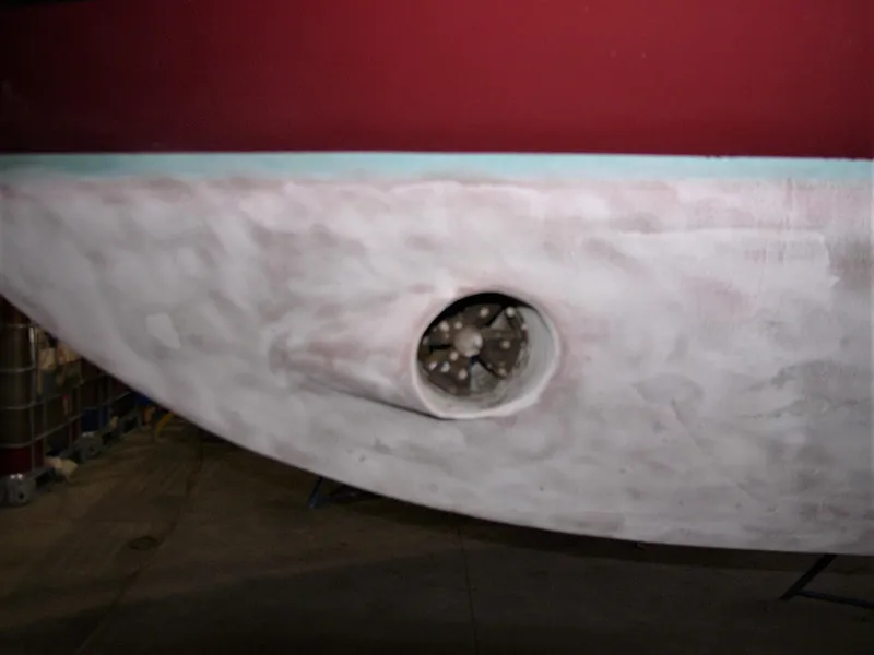 Slide: The Image of 2001 Mast & Mallet 38 Picnic Boat hull with visible propeller detail. - 31