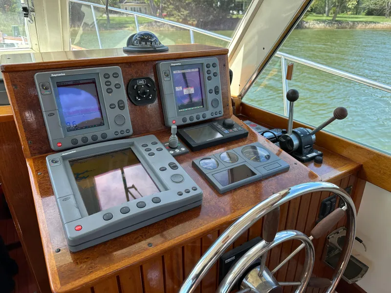 Slide: The Image of Helm of 2001 Mast & Mallet 38 Picnic Boat with navigation equipment and steering wheel. - 7