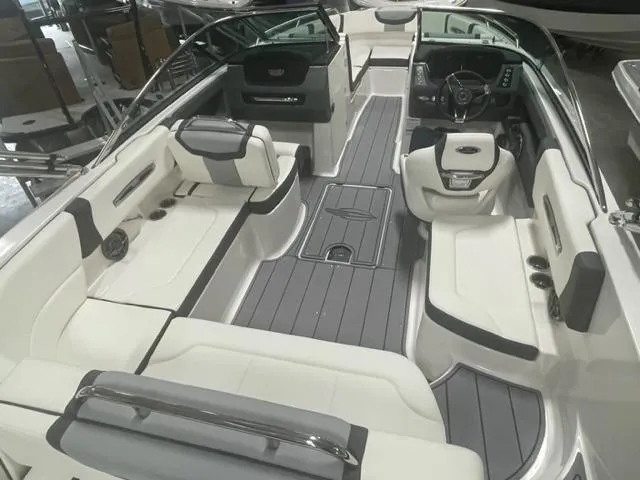 Slide: The Image of 2023 Chaparral 247 SSX boat interior with luxurious seating and modern dashboard. - 3
