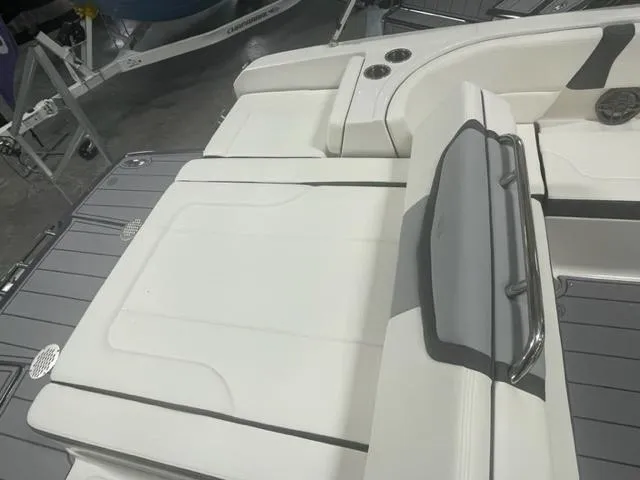 Slide: The Image of 2023 Chaparral 247 SSX boat interior with white seating and gray accents. - 5