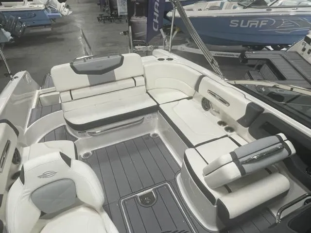 Slide: The Image of 2023 Chaparral 247 SSX boat interior with white and gray seating. - 6