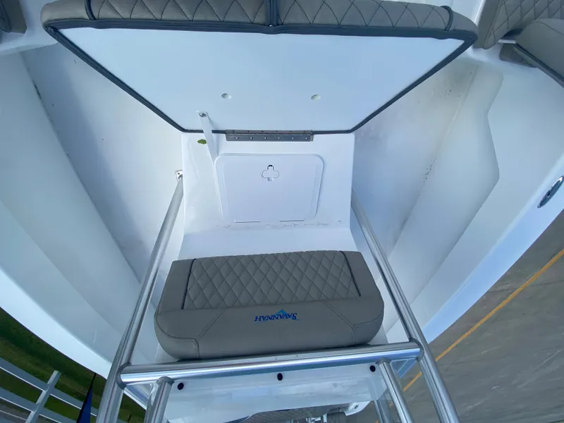 Slide: The Image of 2024 Savannah SS21 boat interior with cushioned seating and storage compartment. - 11