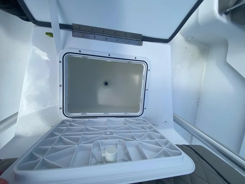 Slide: The Image of Open storage compartment in 2024 Savannah SS21 boat. - 12