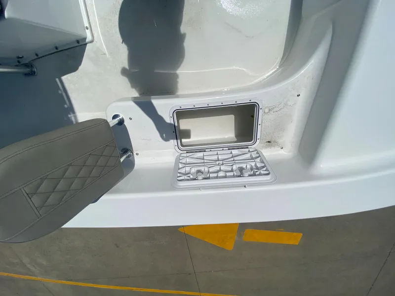 Slide: The Image of 2024 Savannah SS21 boat interior with open storage compartment and seat. - 15