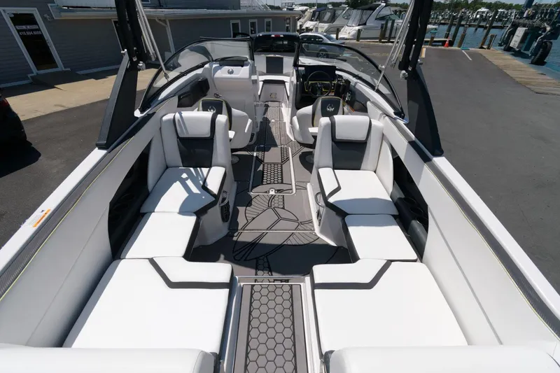 Slide: The Image of 2017 Scarab 255 HO Impulse boat interior with white seating and modern design. - 12