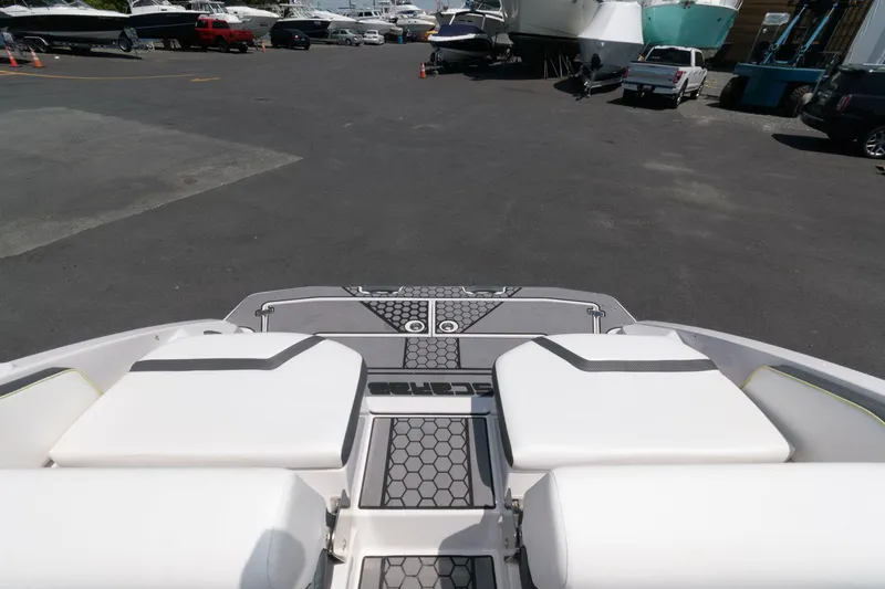 Slide: The Image of 2017 Scarab 255 HO Impulse boat at a marina with other boats. - 5