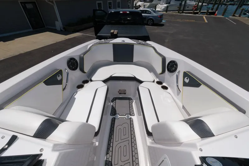 Slide: The Image of 2017 Scarab 255 HO Impulse boat interior with white seating and black accents. - 7