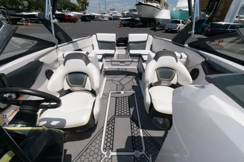 Slide: The Image of 2017 Scarab 255 HO Impulse boat interior with white and black seating. - 8