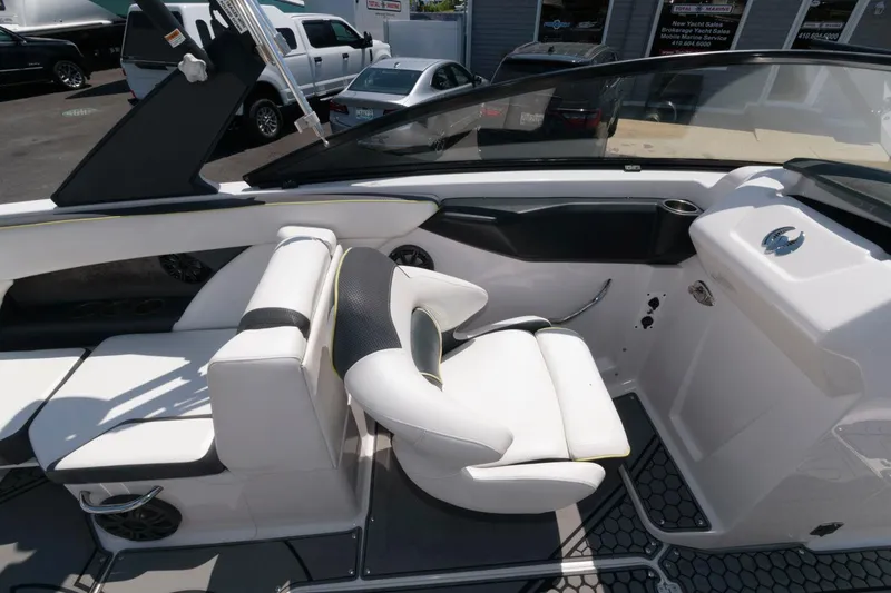 Slide: The Image of 2017 Scarab 255 HO Impulse boat interior with white seating and steering console. - 9